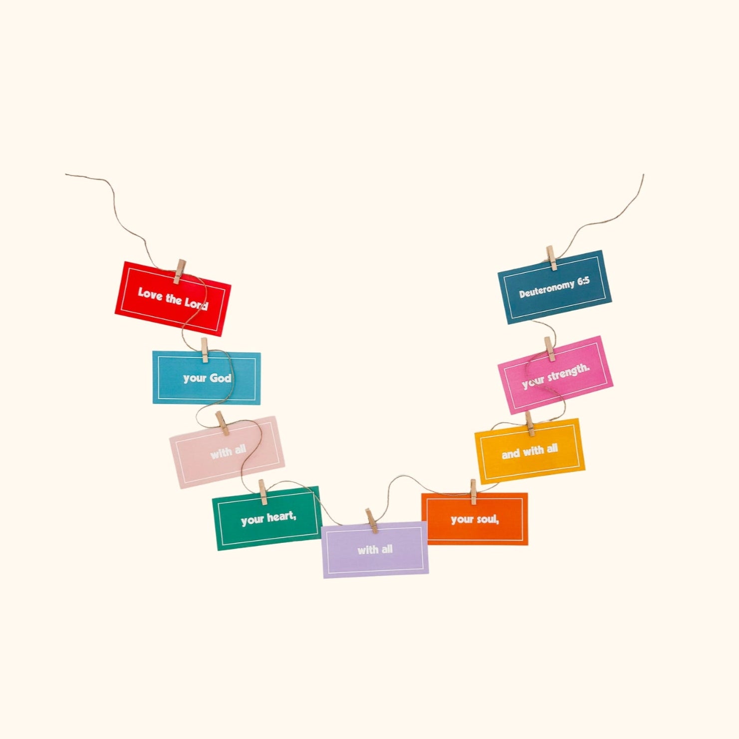 Colorful paper clips with scripture on a white background